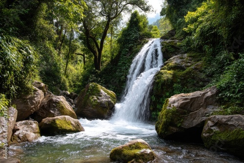 A waterfall cascading down rugged rocks in the tropical forest
