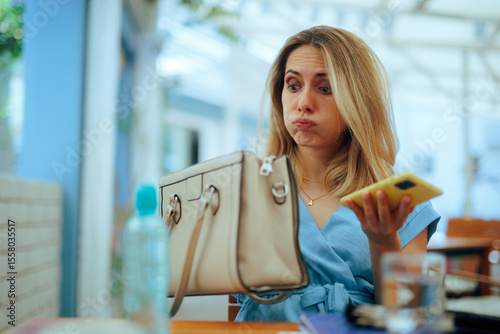 Fotografie Lady Checking her Bag Looking for Something She Lost