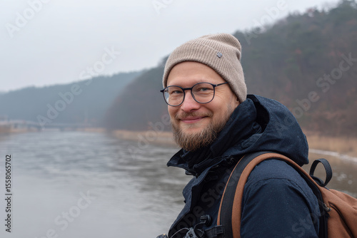 portrait of forester with gentle smile on right side of frame