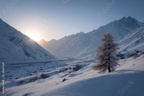 glacial valley in tajikistan at sunrise seen from above