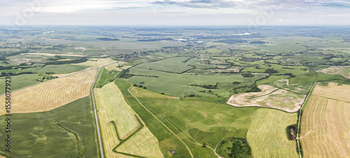 picturesque rural summer landscape with agricultural fields, meadows, village. panoramic aerial view.