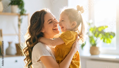 A mother and her child laughing joyfully while playing peek-a-boo in a sunlit living room
