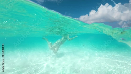 Wallpaper Mural Enjoy an unforgettable and truly magical underwater experience swimming with graceful stingrays in the stunning turquoise waters of the beautiful Cayman Islands, a true tropical paradise for all Torontodigital.ca