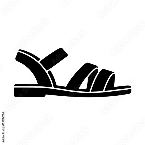 Strappy sandal icon filled – symbol of summer comfort and casual fashion