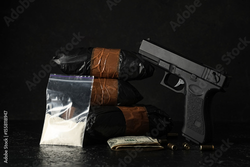 Drug packages with gun, bul...