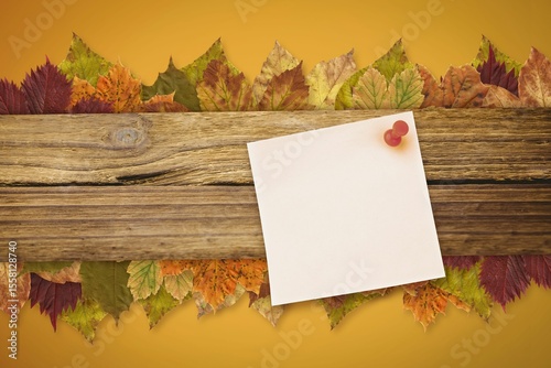 Autumn leaves with yellow note