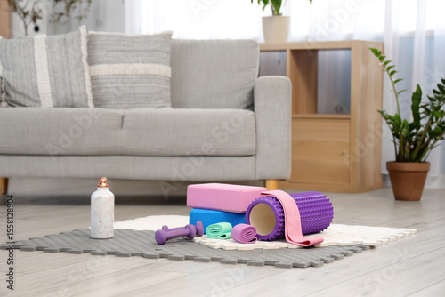 Sports equipment on mat in ...