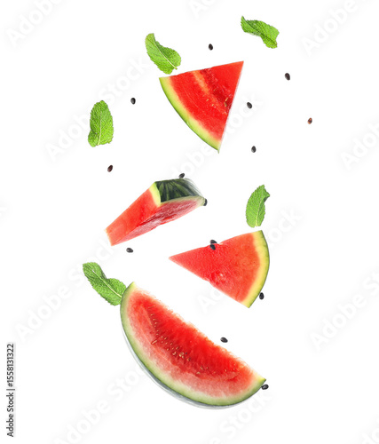 Flying pieces of fresh watermelon with mint and seeds on white background © Pixel-Shot