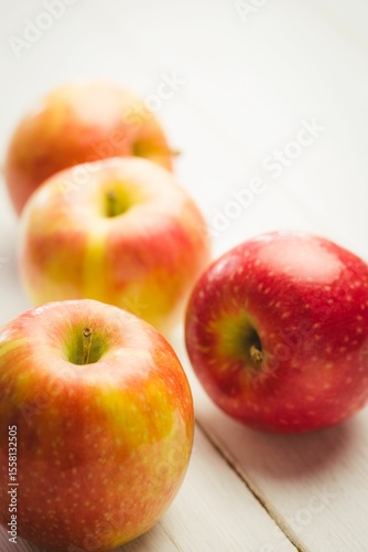 Fresh red apples on table