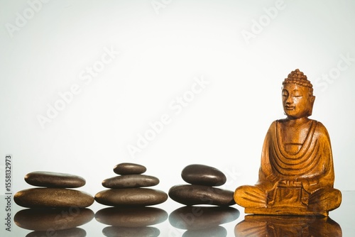 Buddha statue with stacked stones