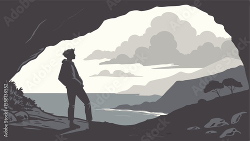 Silhouette of a person standing in a cave looking out at the ocean and mountains with cloudy sky view
