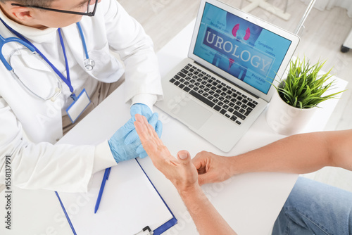 Male urologist working with...