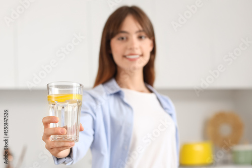 Young woman with glass of l...