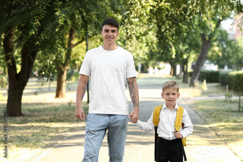 Father walking his little s...