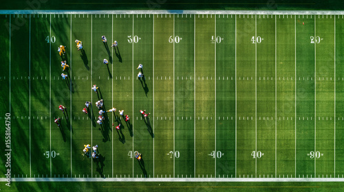 Top-down view of an American football field with marked lines and goalposts, vibrant green turf, perfect for sports, teamwork, training, and outdoor game concept.