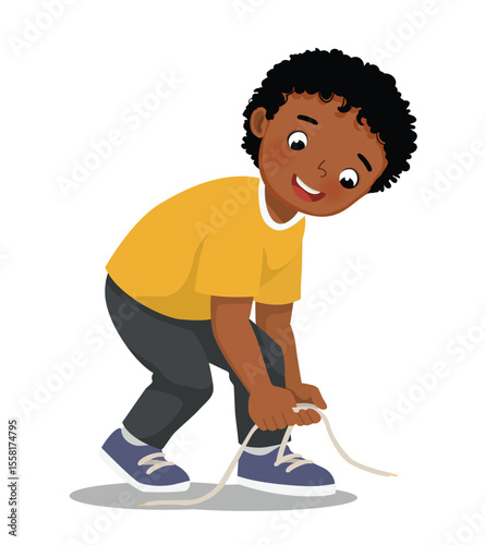 Little African boy tying his shoelaces
