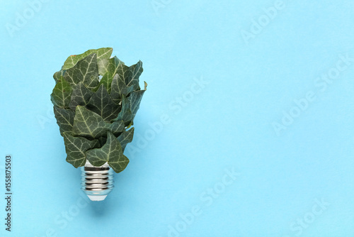 Light bulb with plant leave...