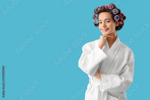 Young woman in bathrobe wit...