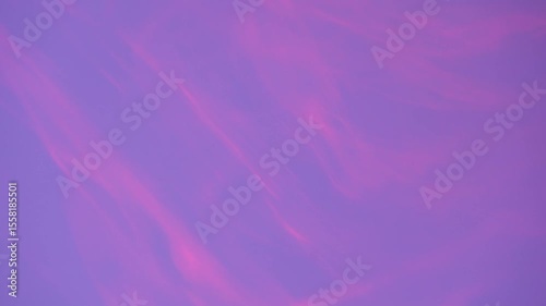 Gentle purple backdrop with slowly drifting pink motion streaks. Ideal for ambient and calming edits.