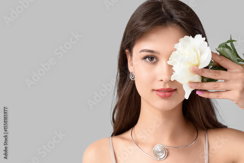 Young woman with peony flow...