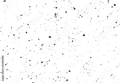 Random ink splatter texture with scattered black spray spots. Grunge artistic background design for creative prints and overlays. Abstract detail pattern.