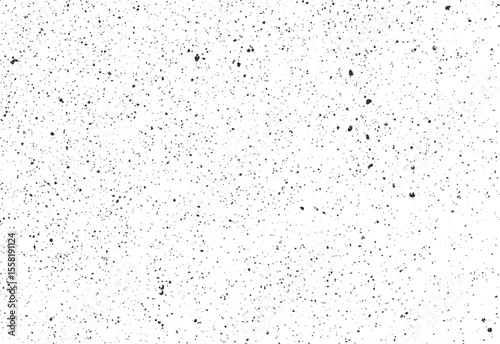 Fine speckled ink splatter texture with random grunge spots and soft scattered dust. High-resolution vector background for retro or print designs.
