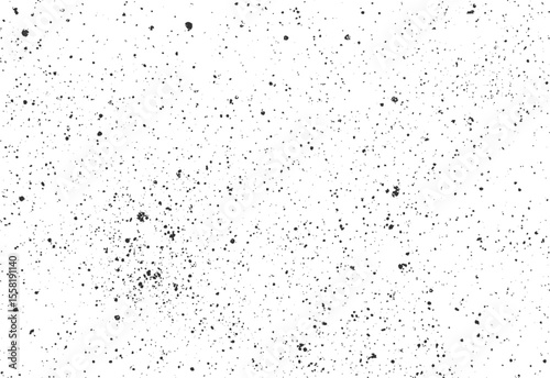 Grunge ink spray texture with concentrated splatter cluster. Urban vector background with scattered paint droplets on white.