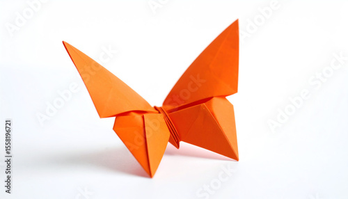 An elegant orange origami butterfly sits against a white background, showcasing intricate folds and a vibrant hue