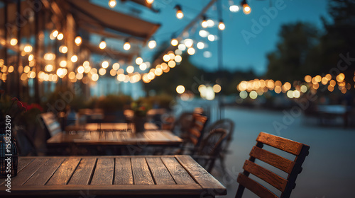 Charming outdoor restaurant ambiance with soft lighting and inviting wooden furniture on a cool evening
