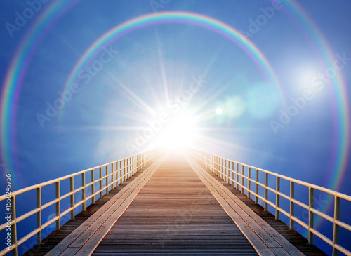 The road leading to heaven. The sun, the rainbow and the bridge to the sky. A good background on the topic of religion, faith, motivation, spiritual practice photo