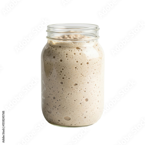 Bubbly, active sourdough starter in a clear glass jar, ready for baking artisan bread. Perfect for culinary blogs, recipes, or fermentation projects.