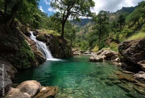 Serene Waterfall Cascading into Crystal Clear Pool Surrounded by Lush Green Trees and Rocky Terrain
