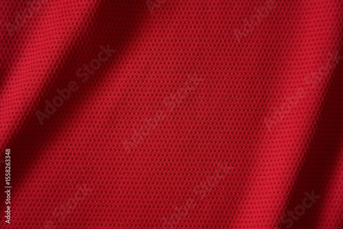Close up of red football jersey sports clothing fabric texture.