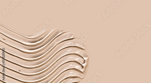 cosmetic texture gel essence smears on a beige background
