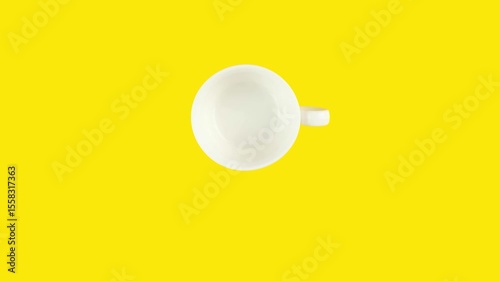 Looping stop motion animation of endless drinking coffee cup by cup on yellow background. Copy space for your text.