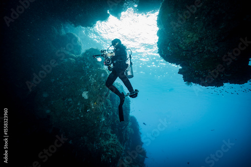 Wallpaper Mural Scuba diver exploring an underwater cavern in Raja Ampat Torontodigital.ca