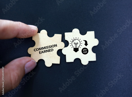  wooden puzzle with icons and icon Commission Earned