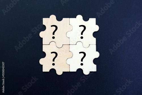 wooden puzzle with a question mark symbol. Concept of question, FAQ, Q and A, confusion and solution. question and answer concept