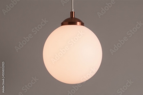 A close-up shot of a single light hanging from the ceiling