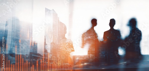 The silhouettes of professionals collaborating in a modern urban setting.