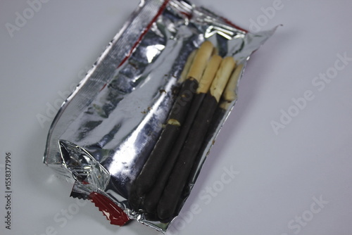 long bread snack covered in chocolate