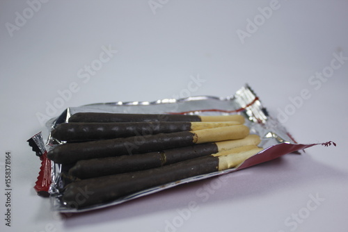 long bread snack covered in chocolate