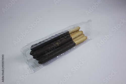 long bread snack covered in chocolate