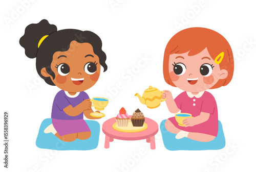 Two adorable little girls enjoying pretend tea party together at home, sitting happily on cushions with tea cups and cupcakes on a small table.