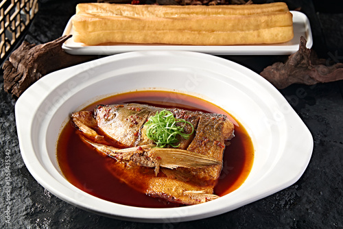 Принти на полотні Wild bighead carp head braised in Beijing-style sauce with large fried dough sti