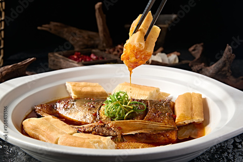 Wild bighead carp head braised in Beijing-style sauce with large fried dough sticks