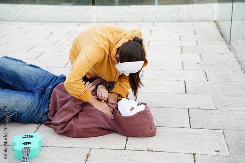 Teenagers practicing drama with masks in class