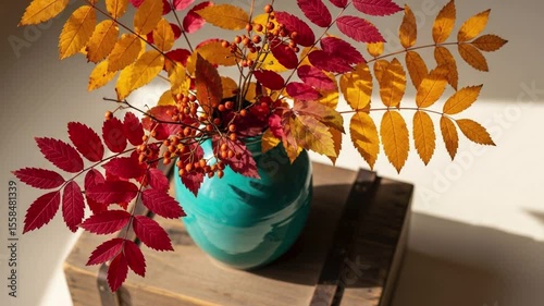 Autumn leaves in vase still life fall colors seasonal decoration