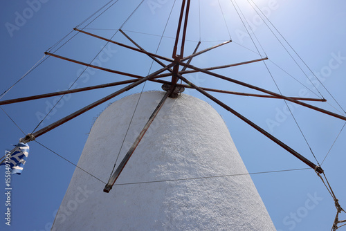 Photos Traditional white windmill in Oia on the island of Santorini