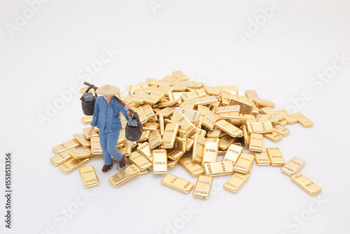 Figure Among Gold Bars Depicting Wealth and Prosperity